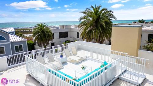 an aerial view of a balcony with the beach at Luxury Penthouse, Ocean Views, Rare Rooftop Sundeck, Private Access to Beach in Siesta Key