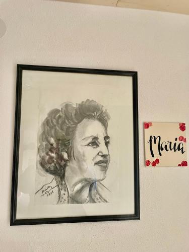 a drawing of a woman hanging on a wall at Haus Mali in Heiligenberg
