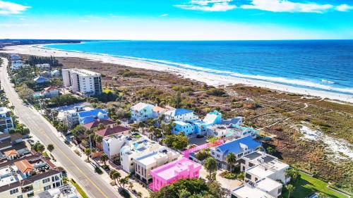 an aerial view of a beach with buildings and the ocean at Luxury Penthouse, Ocean Views, Rare Rooftop Sundeck, Private Access to Beach in Siesta Key