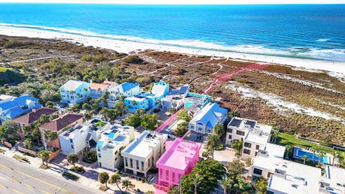 an aerial view of a beach with houses at Luxury Penthouse, Ocean Views, Rare Rooftop Sundeck, Private Access to Beach in Siesta Key