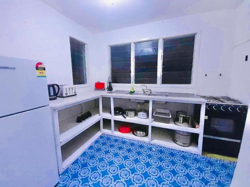 Ένα ή περισσότερα κρεβάτια σε δωμάτιο στο Private Double Room - Horizon Tonga Cottage