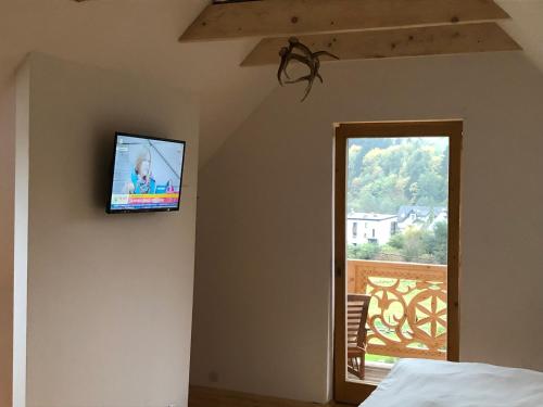 TV a/nebo společenská místnost v ubytování Willa Słońce