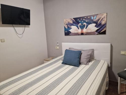 Postel nebo postele na pokoji v ubytování Habitaciones Zoe