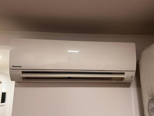 a laptop computer sitting on top of a wall at Cozy private apartment WiFi 1BR Sleeps 4 great Central Location in Võru