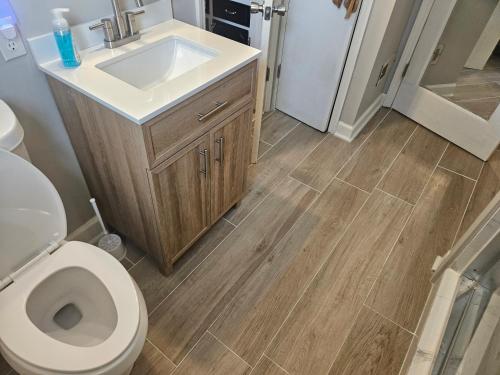 a bathroom with a sink and a toilet at Private Single Level Standalone House Large Lot - 3 Bedrooms in Charlotte