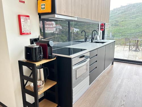 Kuchyň nebo kuchyňský kout v ubytování Empreendimento SERRA