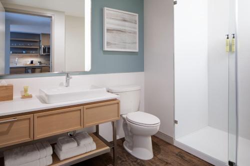 a bathroom with a toilet and a sink and a shower at Element Salt Lake City Downtown in Salt Lake City