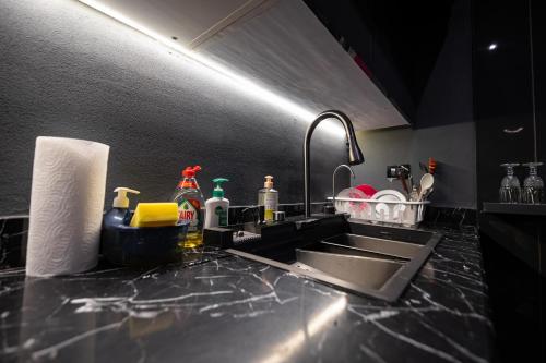 a kitchen with a sink and a counter top at The Palm Terrace Penthouse 3BR - Palm Hills - 280 sqm in Cairo