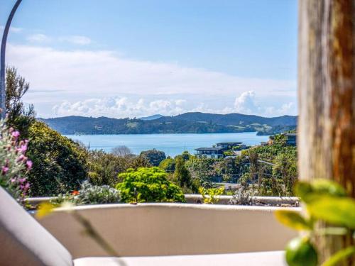 a view of the ocean from a balcony at The Tree Tops Oasis in Paihia