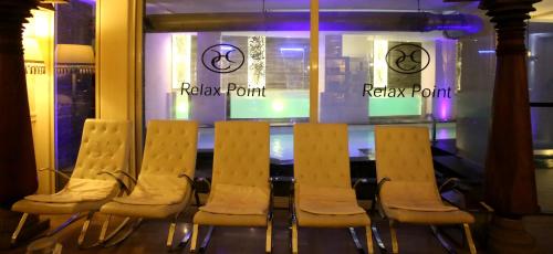 a row of chairs sitting in front of a window at Hotel Columbia Wellness & Spa in Montecatini Terme