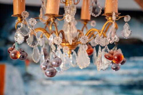 a chandelier with crystals and cherries on it at Hotel Boutique Aldea del Mar in Pichilemu