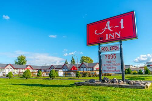 a sign for an inn in front of a building at A1 Inn Niagara Falls in Niagara Falls
