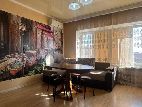 a dining room with a table and chairs at 3 комнатная ЖК Альтаир in Aktobe