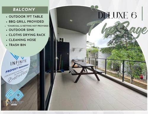 a view of a balcony with a picnic table at Roxy Sematan Beach Townhouse Deluxe 3 ,5 & 6 in Sematan