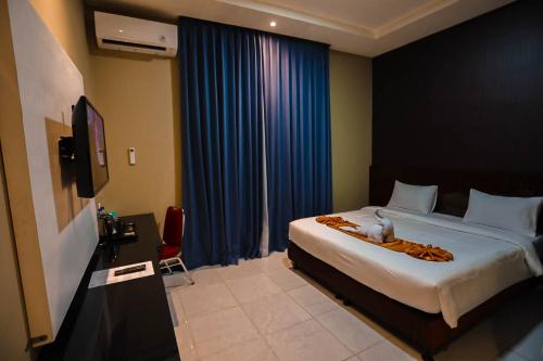 Katil atau katil-katil dalam bilik di Vitta Hotel Manokwari