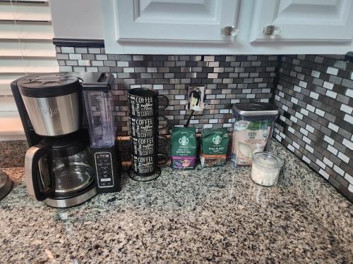 a counter with a coffeemaker and a coffee maker at Amazing DC Home Away From Home in Washington, D.C.