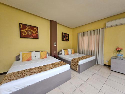 Postel nebo postele na pokoji v ubytování Hotel Nicanor
