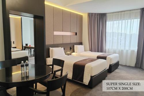 Кровать или кровати в номере The Pearl Kuala Lumpur