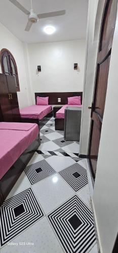 Una cama o camas en una habitación de FADL Kato