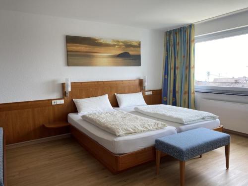 a bedroom with two beds and a window at Apartment Annemarie 4 in Meersburg