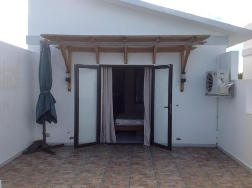 a room with an open door with a bed in it at Dreamhome in Balaclava