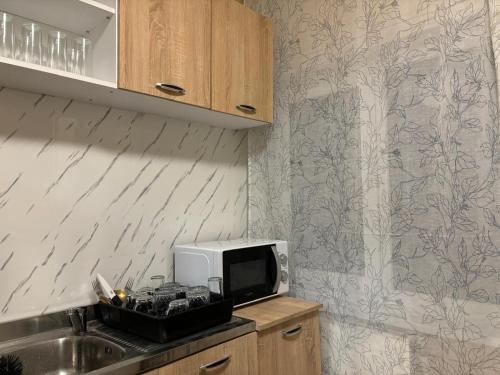 Η κουζίνα ή μικρή κουζίνα στο Vila Eden Azuga