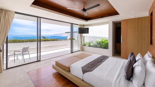 En eller flere senge i et værelse på Splash: Contemporary Tropical Five Star Villa