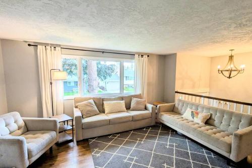 a living room with two couches and a window at Windsor House in Spokane