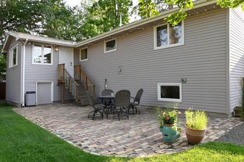 a patio with a table and chairs in front of a house at Windsor House in Spokane