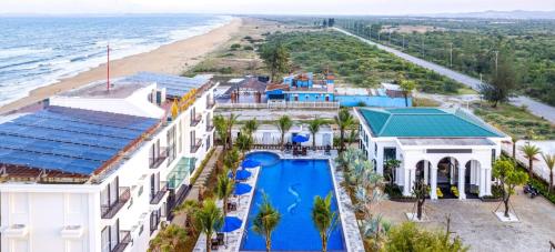 an aerial view of a resort with a swimming pool and the beach at Hoang Yen Boutique Hotel in Dien Ban