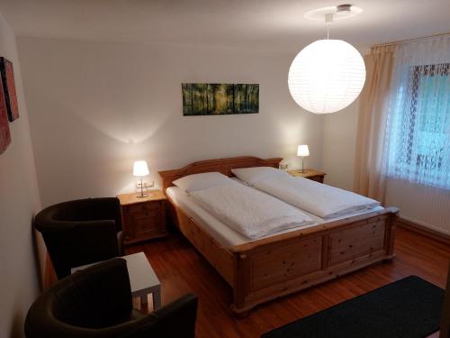 Postel nebo postele na pokoji v ubytování Ferienwohnung am Ulrichsgrünbach