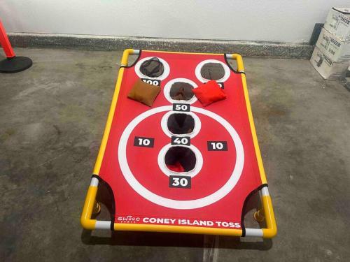 a red and white game table with a panda face on it at 4 Bedroom King Beds One-Story Tesla EV in Riverside