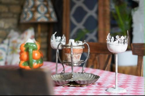 a table with two glasses of ice creamitures on it at Stamford Lodge in Stamford