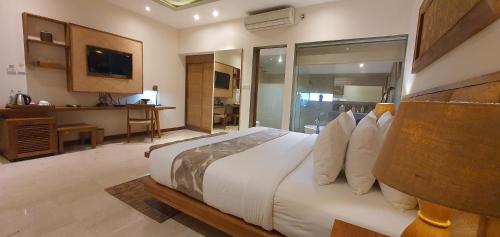 Cama o camas de una habitación en Purana Suite Ubud
