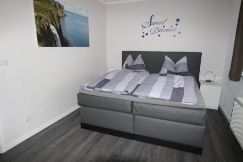 a bedroom with a large bed in a room at FeWo Kruse am Wurmberg in Braunlage