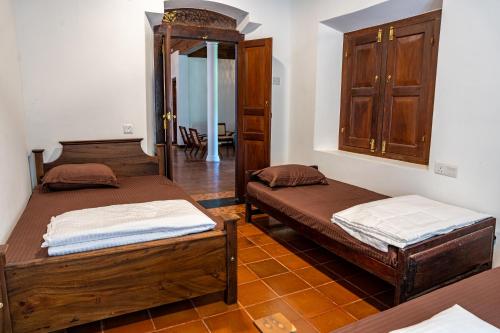 Postel nebo postele na pokoji v ubytování Newlands Bungalow Galle