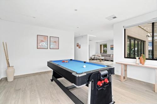 a living room with a pool table in it at Sandcastle in Copacabana