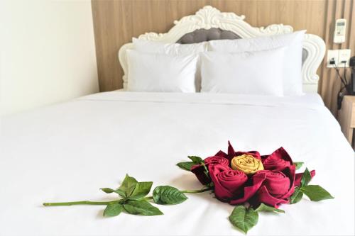 Ένα ή περισσότερα κρεβάτια σε δωμάτιο στο Pearl Beach Hotel Quy Nhon
