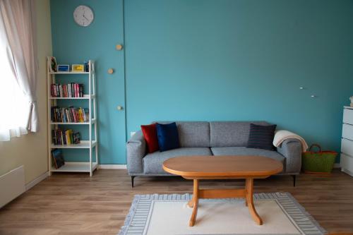 a living room with a couch and a coffee table at Bansko Ski Apartment in Bansko