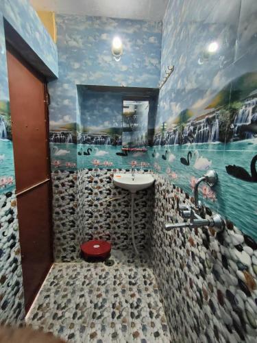a bathroom with a sink and a bath room at MOON NIGHT GUEST HOUSE in Jodhpur