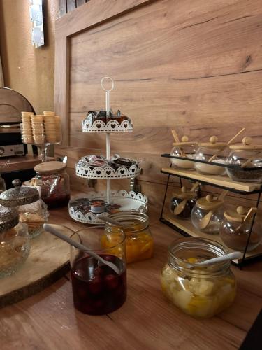 a counter with many jars of food on it at Berghotel Drei Brüder Höhe in Marienberg