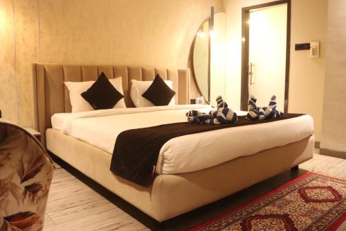 Ένα ή περισσότερα κρεβάτια σε δωμάτιο στο Motel Bilaspur City