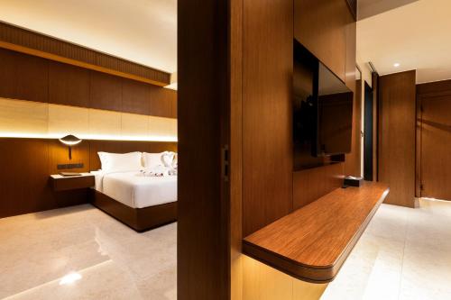 Ένα ή περισσότερα κρεβάτια σε δωμάτιο στο Choasis Hotel-Luang Prabang
