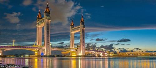 a large bridge over a body of water at night at JJ Homestay Terengganu in Marang