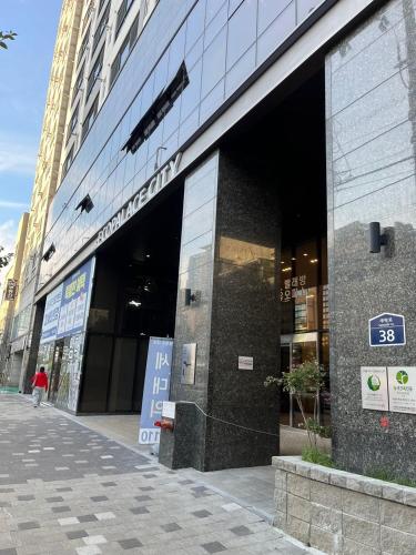 a store front of a building on a city street at Busan Seomyeon Residence in Busan