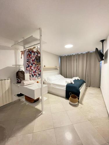 a bedroom with a bed and a mirror in it at Appartamento in Centro Living Pescara in Pescara