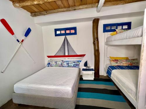 Postel nebo postele na pokoji v ubytování Mira Mira Beach
