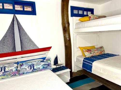 Postel nebo postele na pokoji v ubytování Mira Mira Beach