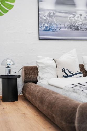 a couch in a living room with a table at City Center Lofts in Vienna