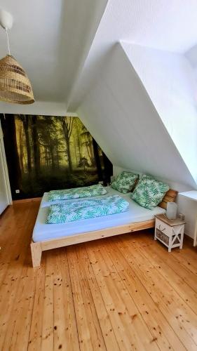 a bed in the middle of a room at Ferienwohnung Ollywood Hill in Halbs